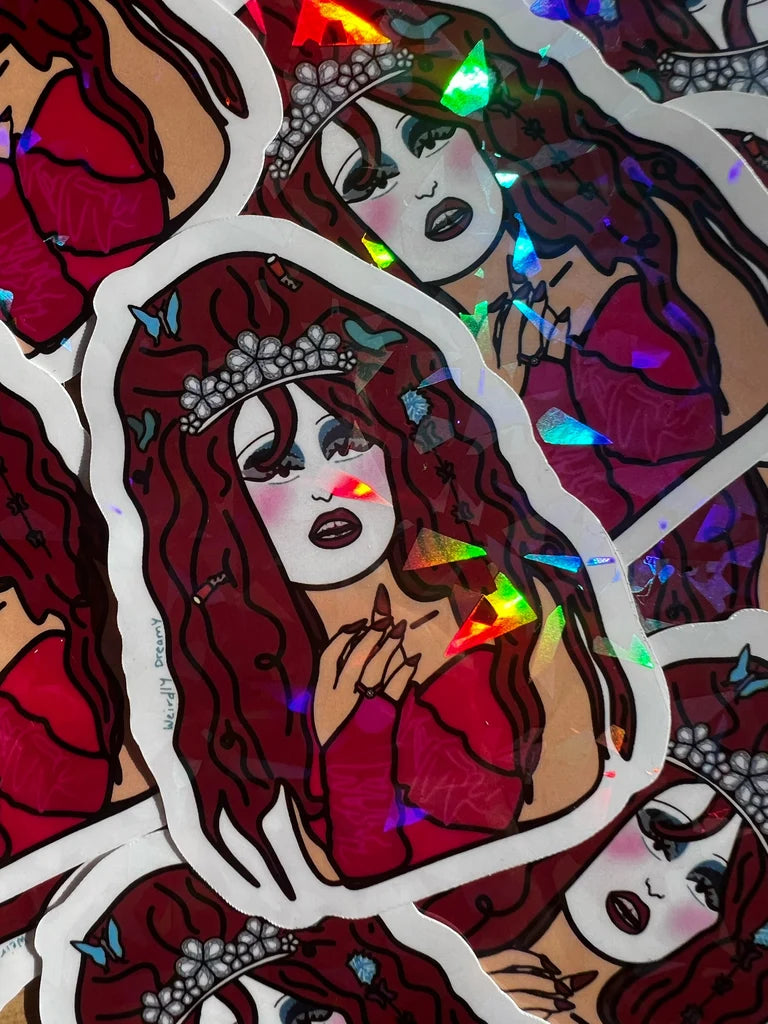 Sticker with a stylized illustration of a woman with red hair and a tiara, surrounded by colorful butterflies.