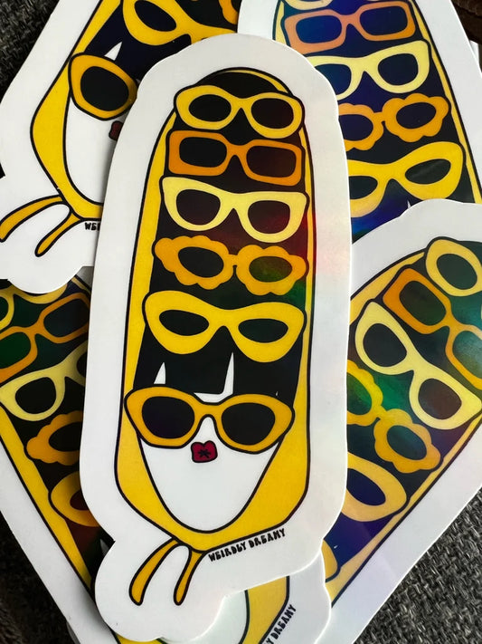 Sticker with a design of a ru pauls drag race season 16 drag queen Nymphia Wind's entrance look wearing sunglasses on a colorful background