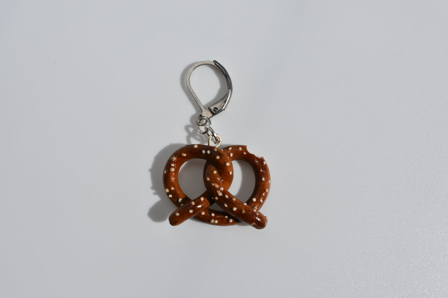 Pretzel-shaped keychain on a white background