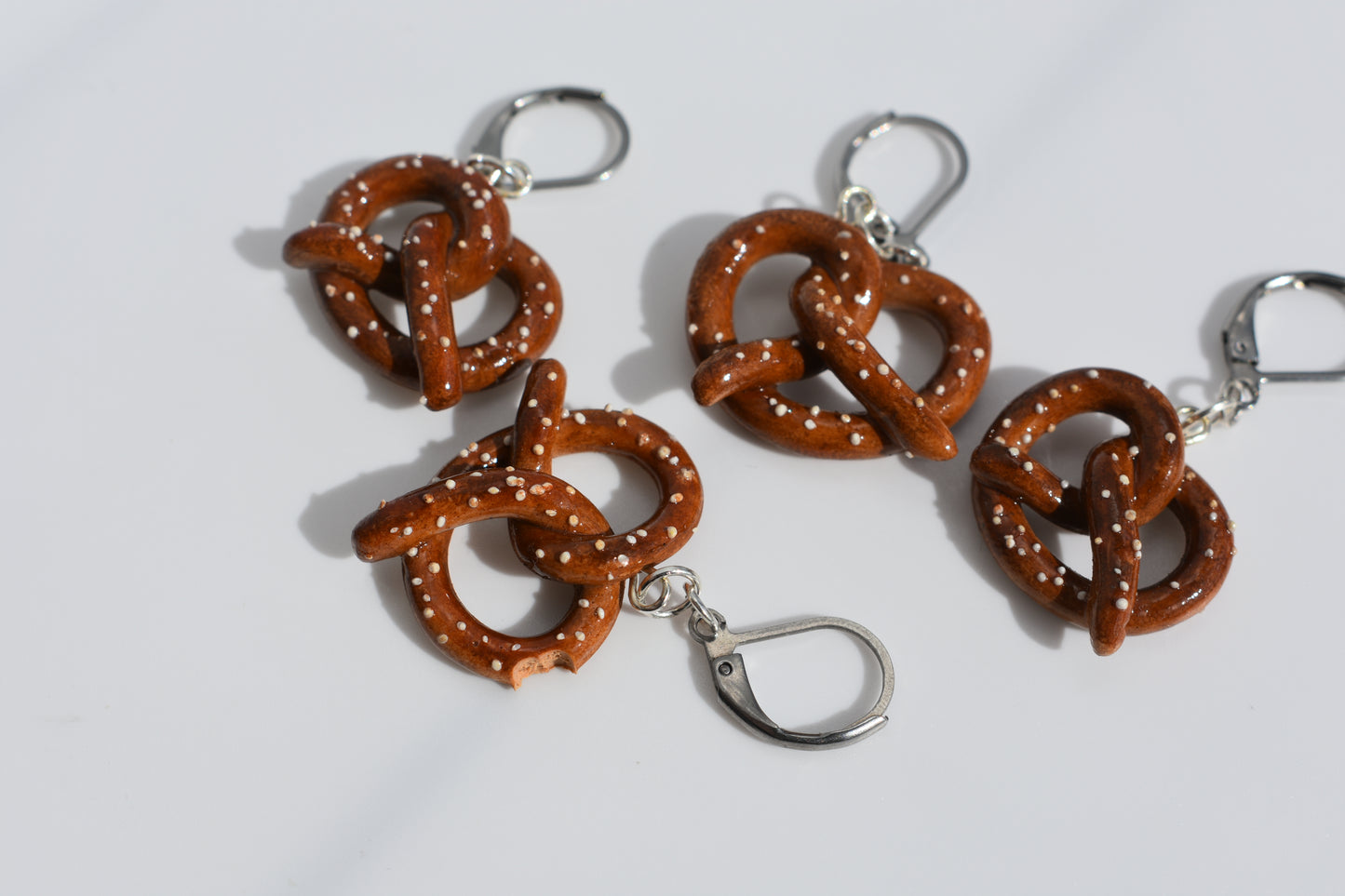 Pretzel-shaped keychains on a white background