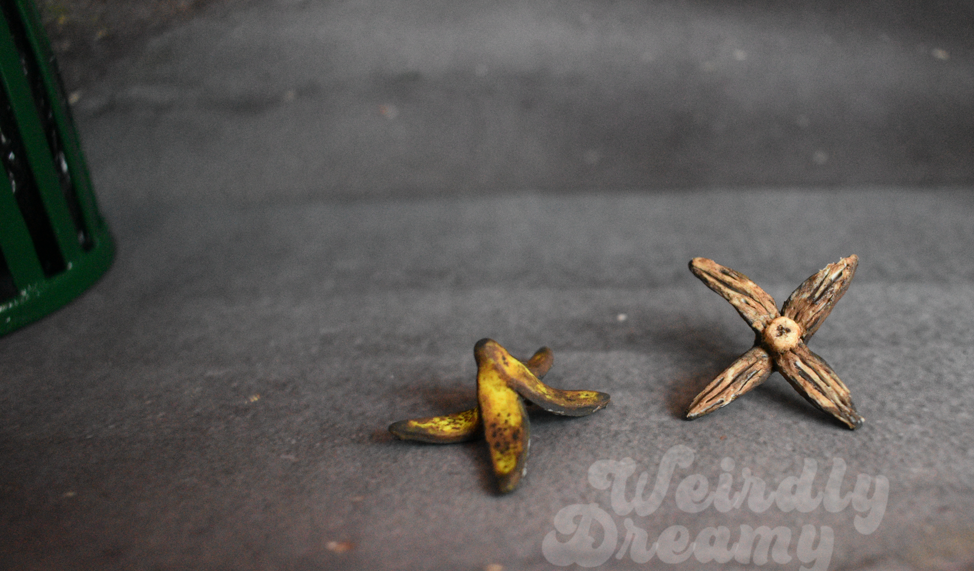 Two miniature banana peels  on a dark surface with 'Weirdly Dreamy' branding.