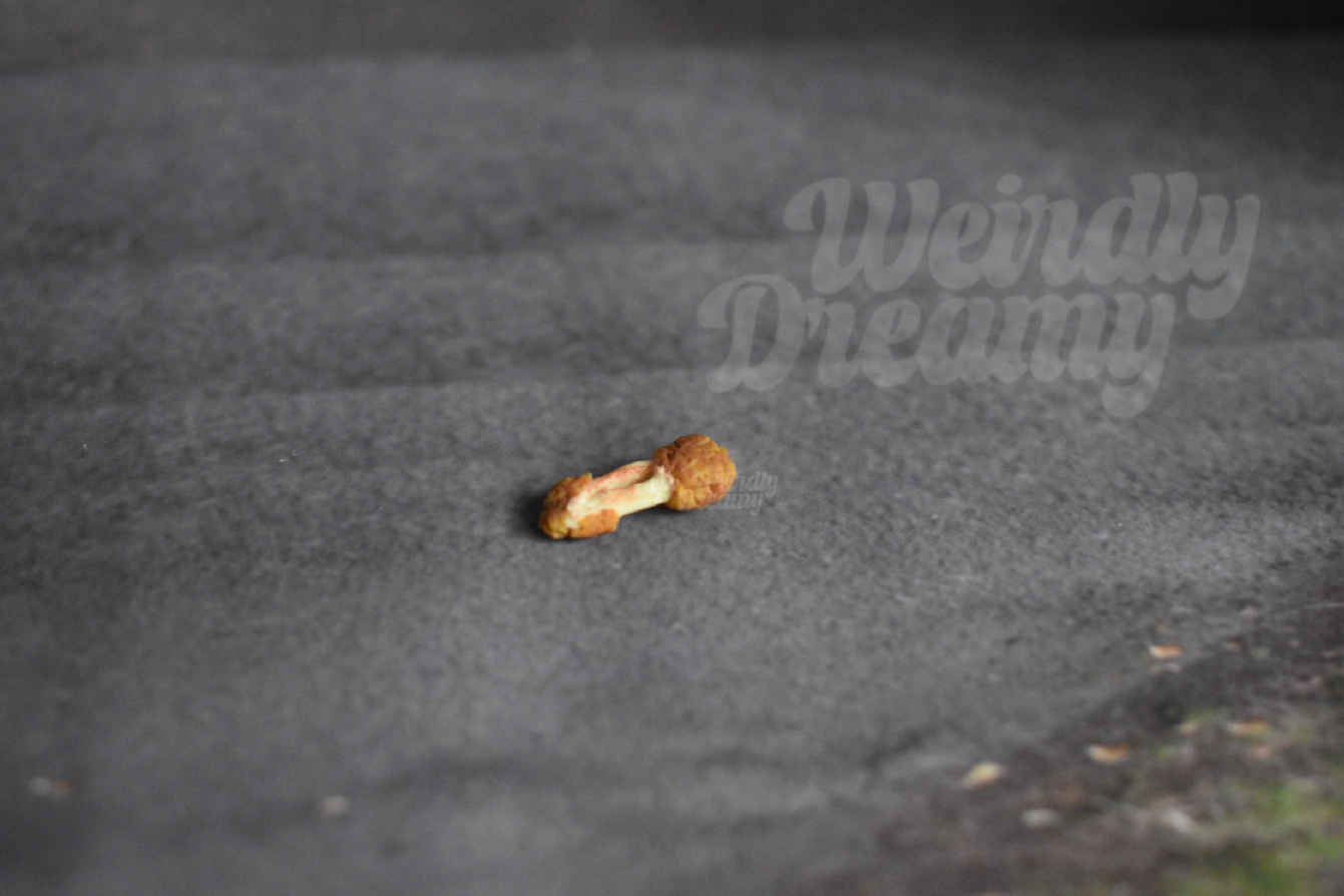 Chicken wing flat on a dark gray surface