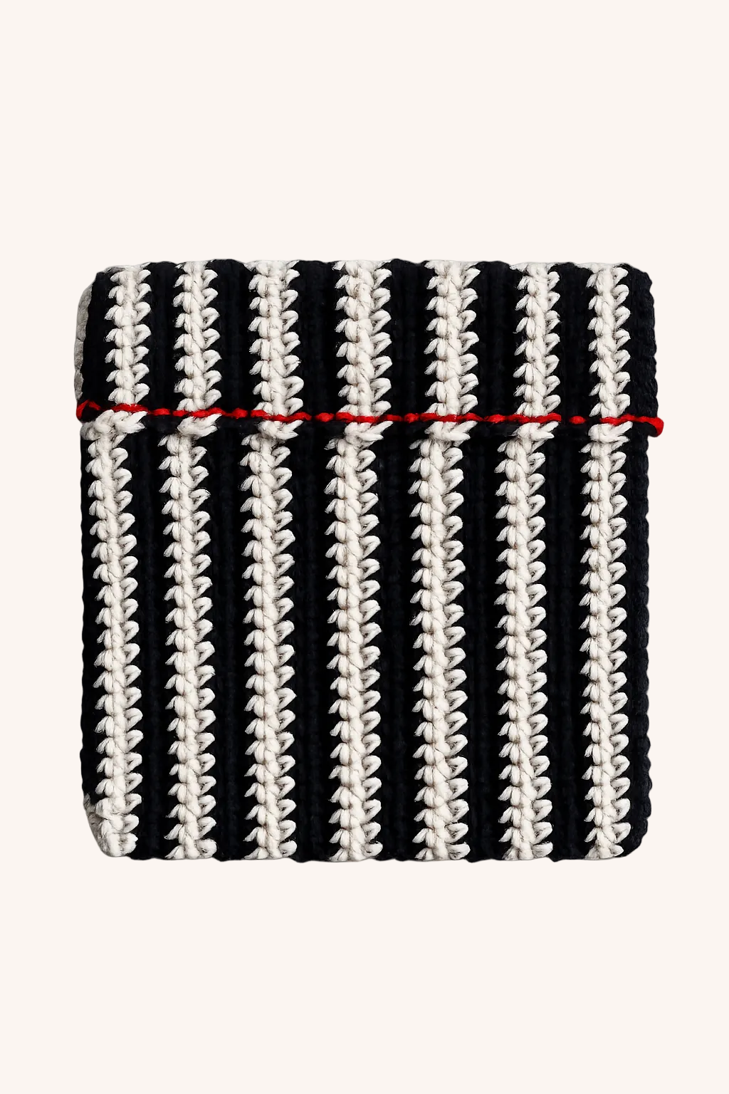A square knit pouch featuring vertical black and off-white stripes with a thin red horizontal stripe across the middle, shown on a plain beige background.