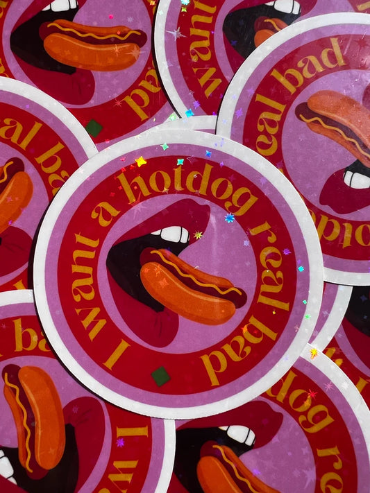 Stack of stickers with a hotdog graphic and text on a red background