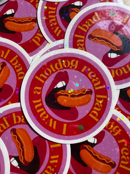 Stickers with a hotdog and text 'I want a hotdog real bad' on a pink background.